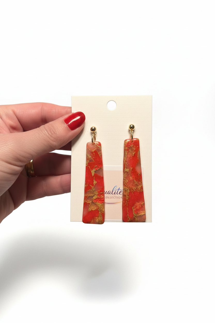 Hand holding earrings clean white background